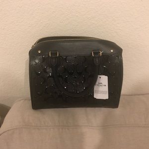 Coach bag with tag